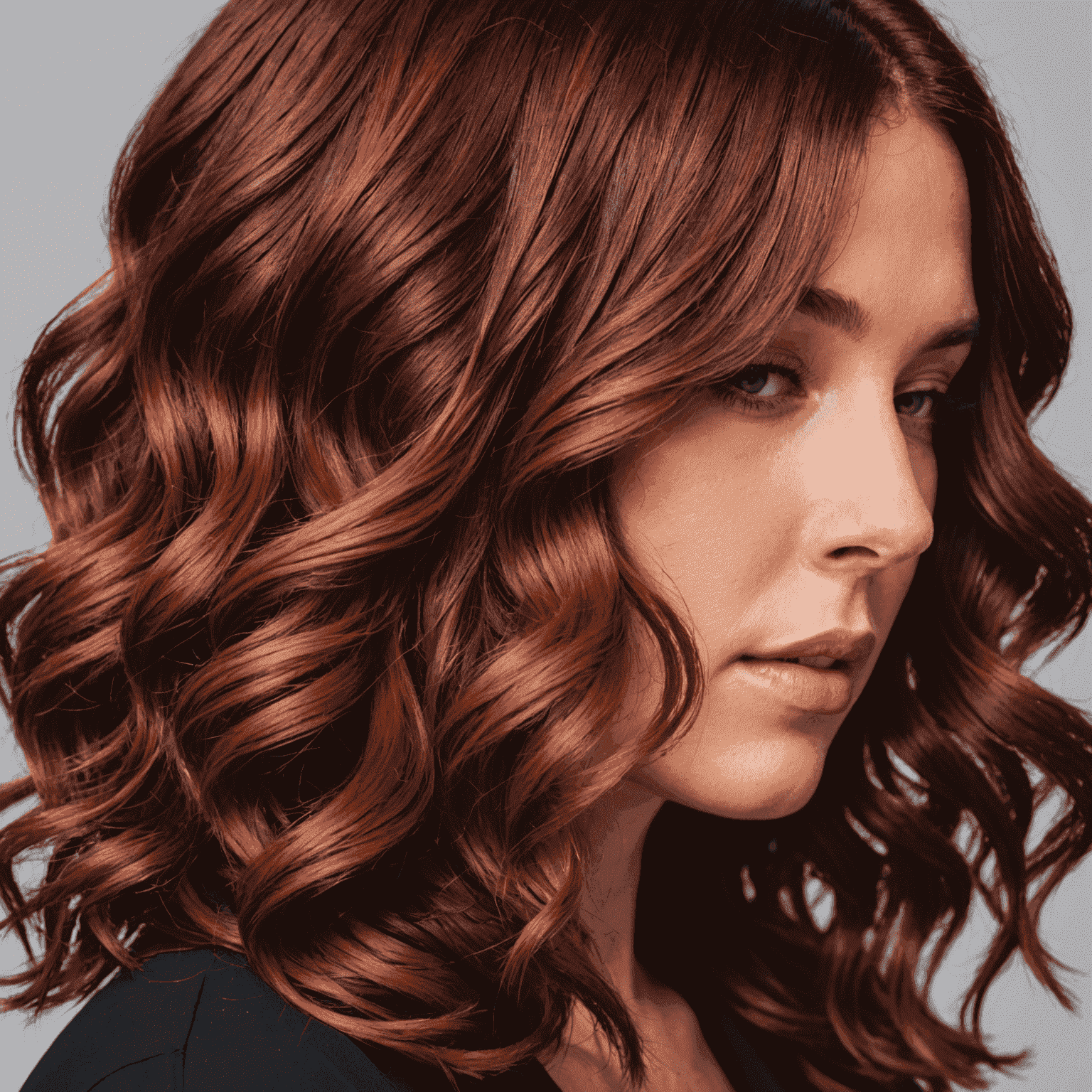 A close-up of vibrant, trendy hair color being applied in a home environment, showcasing the quality of at-home coloring services